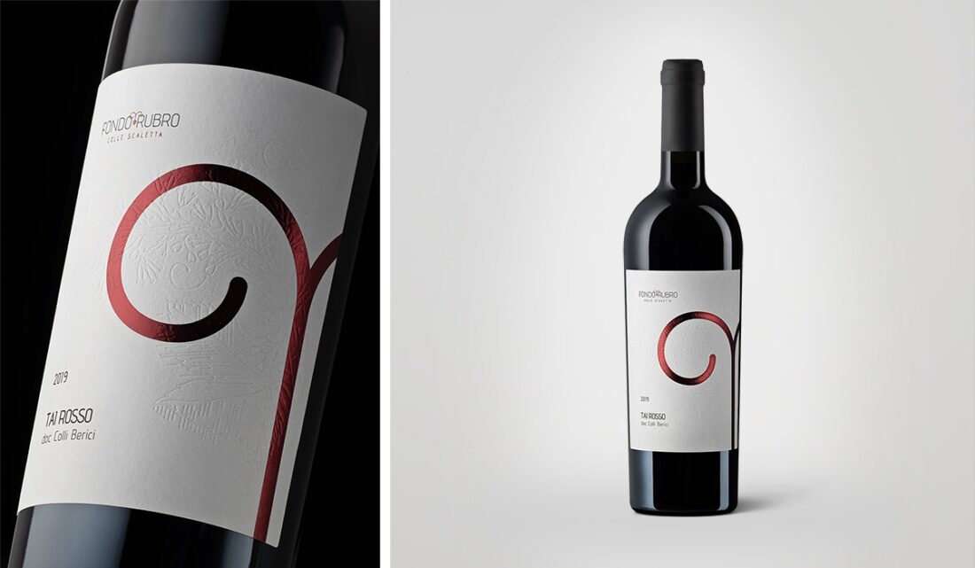 Label and bottle detail of Tai Rosso Fondo Rubro wine, professional beverage photography in Italy.
