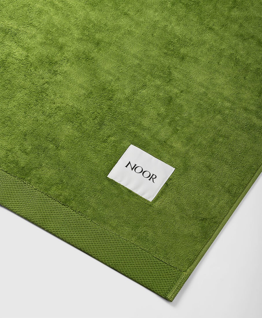 Noor Milano green towel, still life product photography by Inlet Studio in Italy.