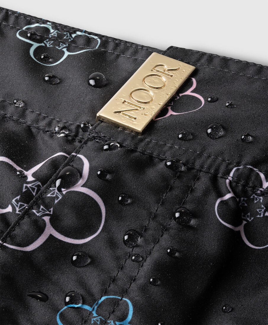 Macro detail of waterproof fabric with NOOR logo, professional photography service in Italy by Inlet Studio.