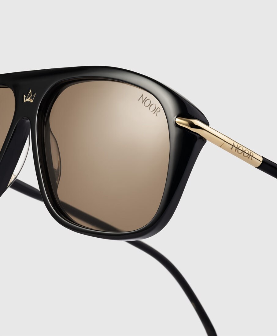 Noor Milano sunglasses in black and gold, fashion accessories photography by Inlet Studio in Italy."